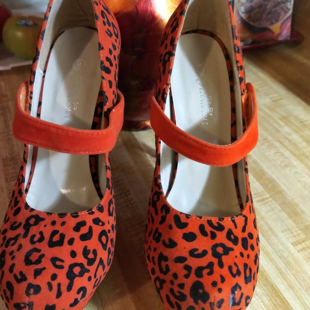 Beautiful Orange and black tiger dotted heels with front wedge .size 8